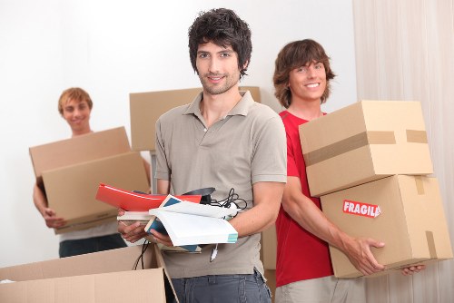 Removalists loading belongings carefully for a local move