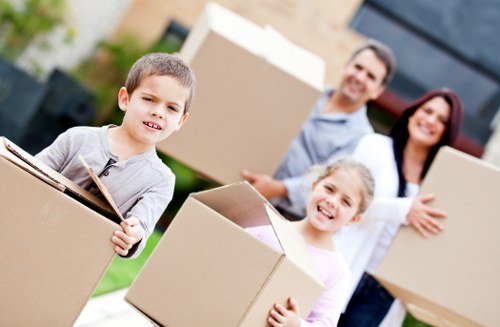 Moving team handling boxes safely during a van removal