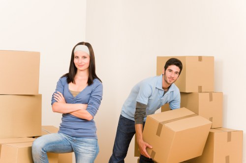 Packed moving boxes and furniture ready for transport
