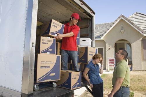 House removal team loading a van for a South London move