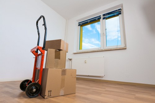 Team organising desks and equipment for an office move in Anerley