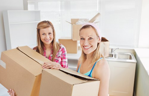 Furniture collection team handling bulky household items in Anerley